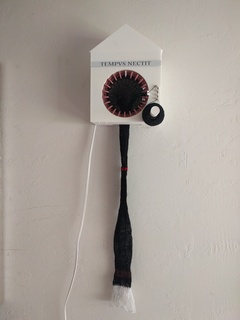 Tempus Nectit knitting clock mounted on the wall